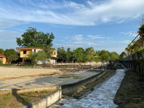 a stone walkway in front of a building at Beautiful River Homestay & Room Mersing in Mersing