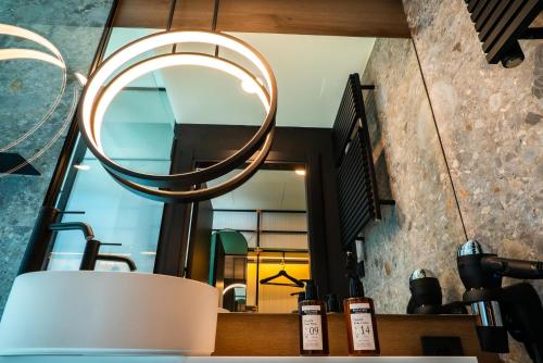 a mirror hangs above a counter in a coffee shop at Akeah Hotel Gran Vía in Madrid