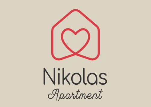 a sign with a heart and the words nitzos appointment at Nikolas Apartment in Alexandroupoli