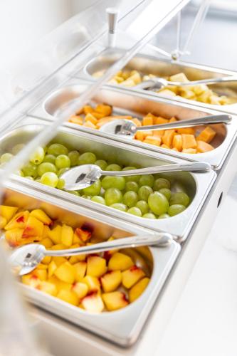 a refrigerator filled with different types of fruits and vegetables at MARINO WELLNESS in Ali Terme