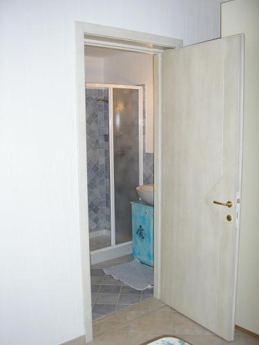 a bathroom with a sink and a toilet in a room at Appartamenti Il Giardino in Porto Rotondo