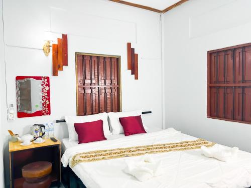 Ένα ή περισσότερα κρεβάτια σε δωμάτιο στο Lotus Blanc Homestay