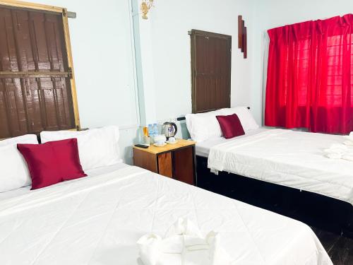 Ένα ή περισσότερα κρεβάτια σε δωμάτιο στο Lotus Blanc Homestay