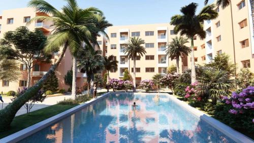 a swimming pool in front of a building with palm trees at Luxury Modern Apartment in the heart of Marrakesh. in Marrakech