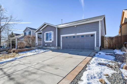 a house with a garage with snow on the ground at Family Retreat 5 Min to USAFA with Mtn Views in Colorado Springs