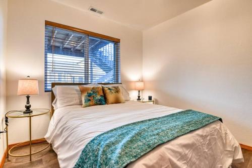 a bedroom with a large bed and a window at Family Retreat 5 Min to USAFA with Mtn Views in Colorado Springs