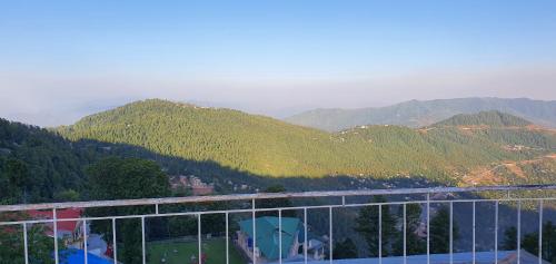 a view of the mountains from a building at Cozy Cottage at Afgan Lodge in Murree