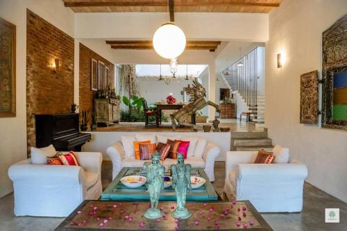 a living room with a couch and a table at GODDESS Kandy in Kandy