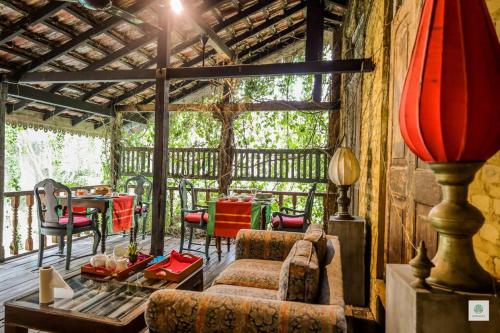a living room with a couch and a table at GODDESS Kandy in Kandy