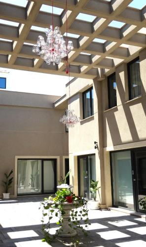 a building with a chandelier hanging from the ceiling at Mar Apartments Alicante, Playa de San Juan in Alicante
