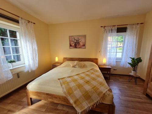 Postel nebo postele na pokoji v ubytování Pension & Ferienhof Glüß