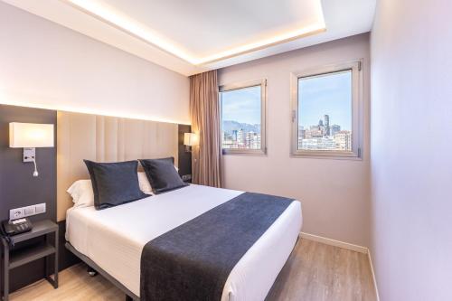 Una cama o camas en una habitación de Hotel Cimbel