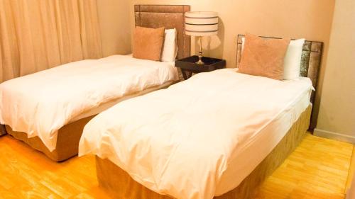 Een bed of bedden in een kamer bij Elton - Piazza Square