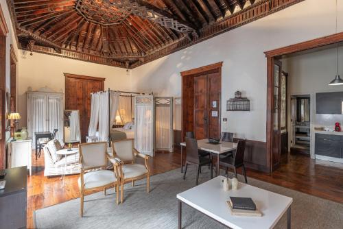 a living room with a table and chairs at Isla Baja Suites in Garachico