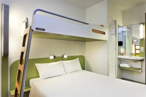 Un ou plusieurs lits dans un hébergement de l'établissement ibis budget Tours Nord