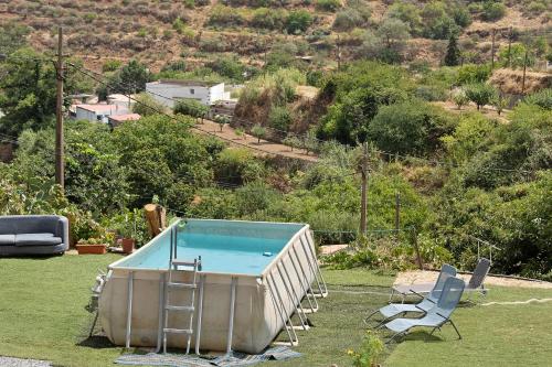 Bazén v ubytování Vv Rural Finca Ecocielo nebo v jeho okolí