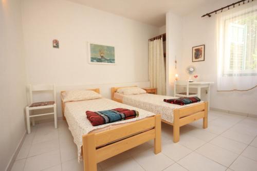 Ένα ή περισσότερα κρεβάτια σε δωμάτιο στο Seaside holiday house Zdrelac, Pasman - 340