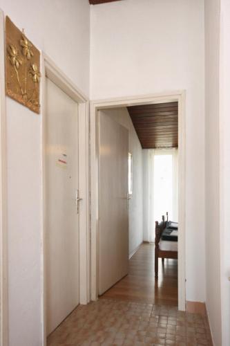 a hallway with a door leading into a room at Apartments by the sea Igrane, Makarska - 311 in Igrane