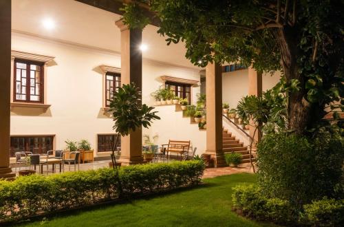 an exterior view of a building with a courtyard at Hanuwant Niwas Jodhpur in Jodhpur