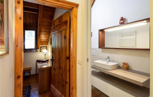 a bathroom with a sink and a mirror at Nice Apartment Santo Stefano in Santo Stefano dʼAveto