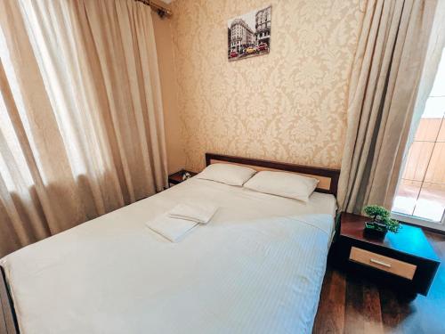 Postel nebo postele na pokoji v ubytování Квартира в центре Крещатика