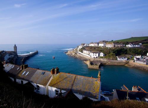 a view of a town with a body of water at The Artist Loft, Ensuite Guest Rooms, Porthleven in Porthleven