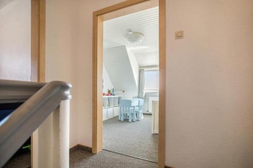 an open door to a room with a dining room at Seehaus Juist in Juist