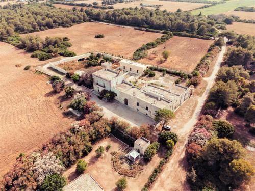 an aerial view of a large building in a field at Masseria Specchiulla in Otranto