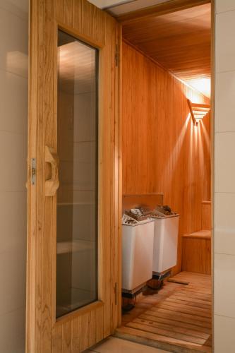 a glass door leading into a kitchen with a counter at DiplomaticHotel in Mendoza
