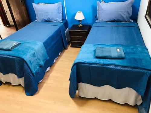 Cama ou camas em um quarto em Rota BH Hostel