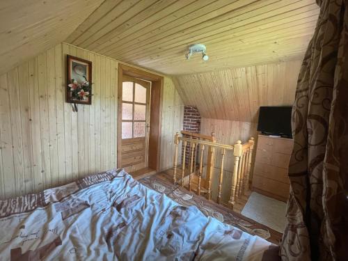 Posteľ alebo postele v izbe v ubytovaní Mini Cottage
