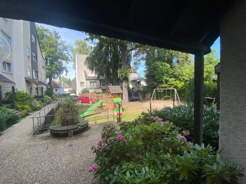 a park with a playground with a swing at stylische Maisonettewohnung Stadionnähe,Wald,Westfalenhalle in Dortmund