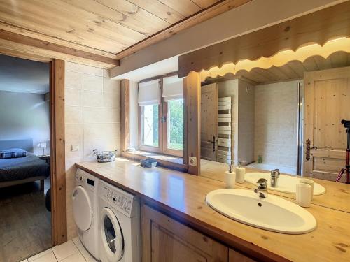 a bathroom with a sink and a washing machine at Appartement Combloux, 3 pièces, 5 personnes - FR-1-560-27 in Combloux
