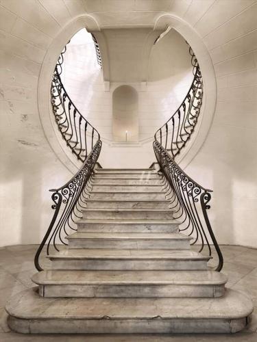 a spiral staircase in a building with a stair case at Civico 62 - Case Vacanza D Andrea in Pratola Peligna