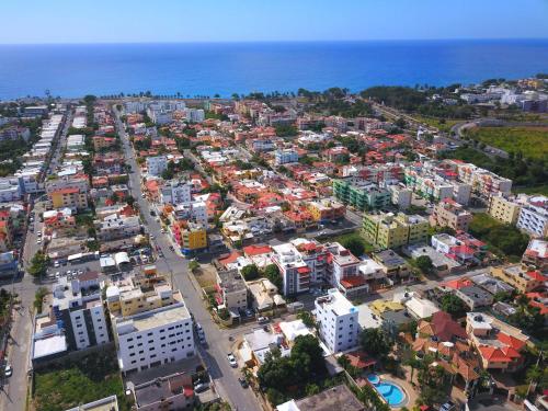 an aerial view of a city with buildings and the ocean at Serviced 1 Bedroom Apartment in Corales del Sur in La Viva