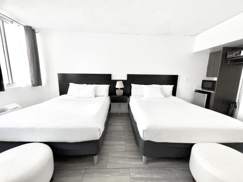 Cama o camas de una habitación en Beach Gardens