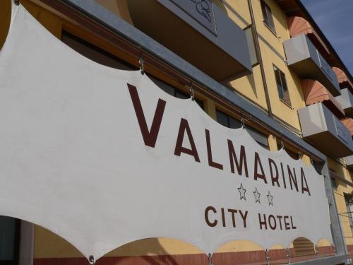 a sign for a city hotel on the side of a building at Valmarina in Calenzano