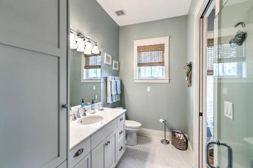a bathroom with a sink and a toilet and a shower at Breezy Home with Grills, Pool and Beach Access! in Big Blackjack Landing