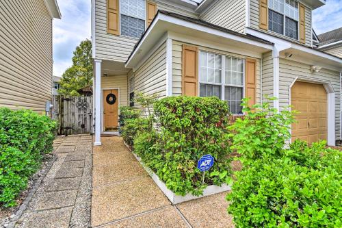 a house with a blue sign in front of it at Hampton Home with Fireplace and Close to Beaches! in Hampton