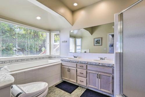 a bathroom with a tub and a toilet and a sink at Dreamy Sonoma Coast Home with Waterfront Views in Bodega Bay