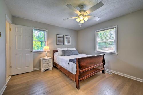 a bedroom with a bed and a ceiling fan at Charming Retreat on 5 Acres with Deck and Grill! in Monticello