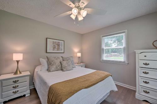 a bedroom with a bed and a ceiling fan at Charming Retreat on 5 Acres with Deck and Grill! in Monticello