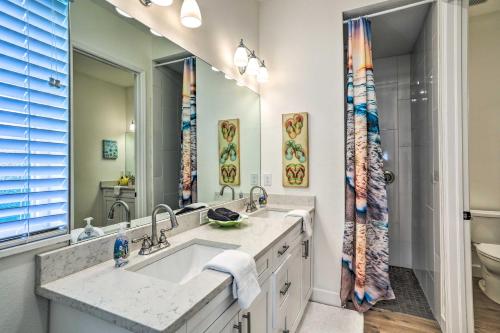 a bathroom with a sink and a toilet at Tampa House with Patio, Near Downtown and Beaches! in Tampa