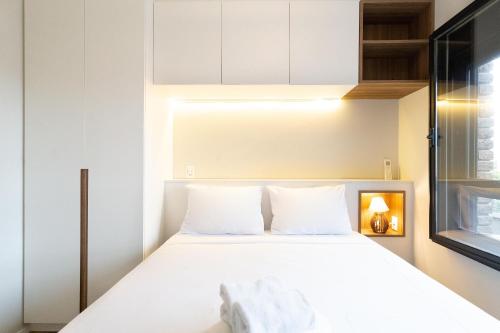 Cama o camas en habitación en piso recientemente reformado, tranquilo y con infraestructura de ocio en Vila Madalena