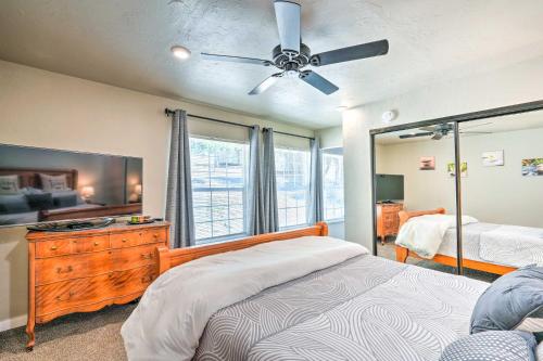 a bedroom with a bed and a ceiling fan at Pleasant Wine Country Escape with Fire Table! in Fair Play