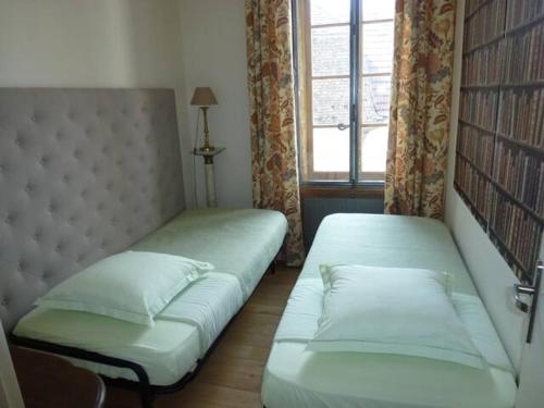 Ένα ή περισσότερα κρεβάτια σε δωμάτιο στο Appartements de la Cote 6