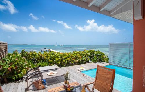a view of the ocean from the balcony of a house at Les Villas du Lagon in Le François