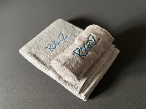 a towel with writing on it sitting on a table at Pia am See - Bio Design Appartement in Bad Wiessee