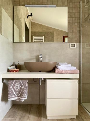 a bathroom with a sink and a mirror at il Giglio B&B in Asola