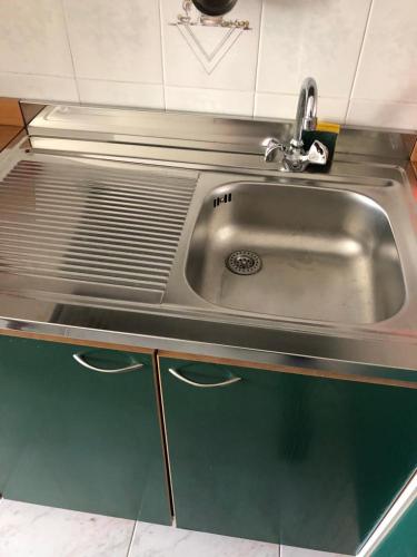a kitchen sink with a faucet on top of it at Campodigiove Amelia in Campo di Giove